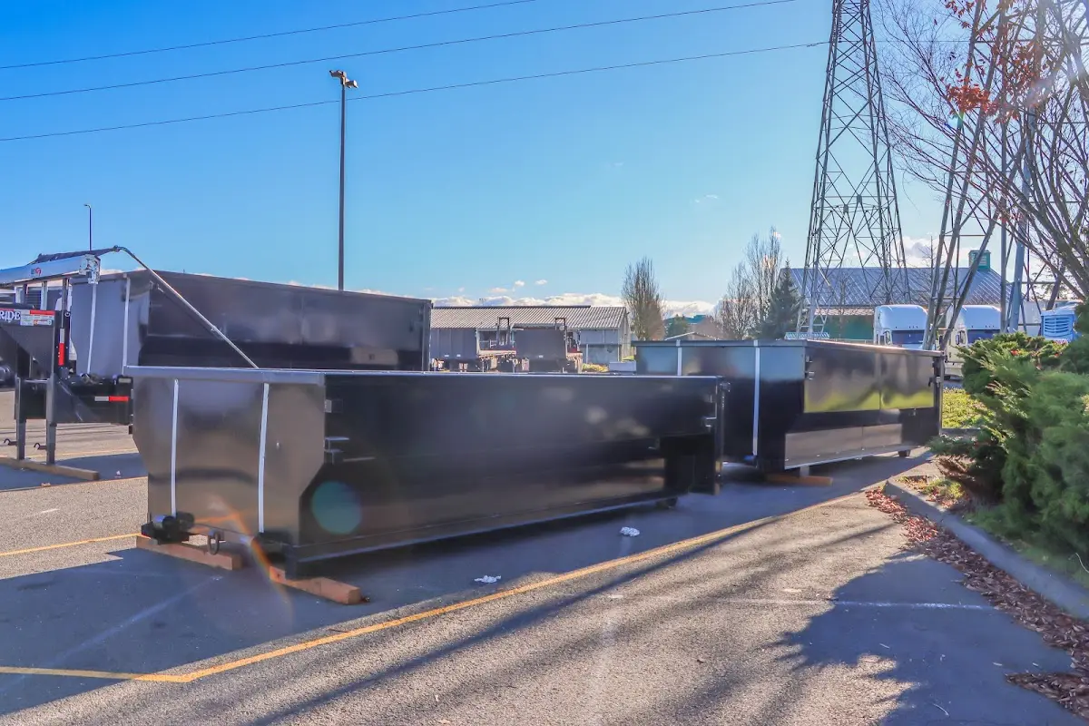 Roll-off dumpster ready for waste disposal at job site for 2 Yard Dumpster Rental in Harwich